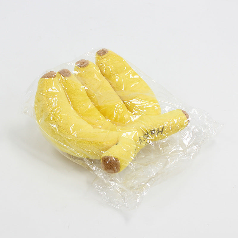 Dog makes noises and chews on plush banana toys  fun and entertaining toy for dogs to relieve boredom